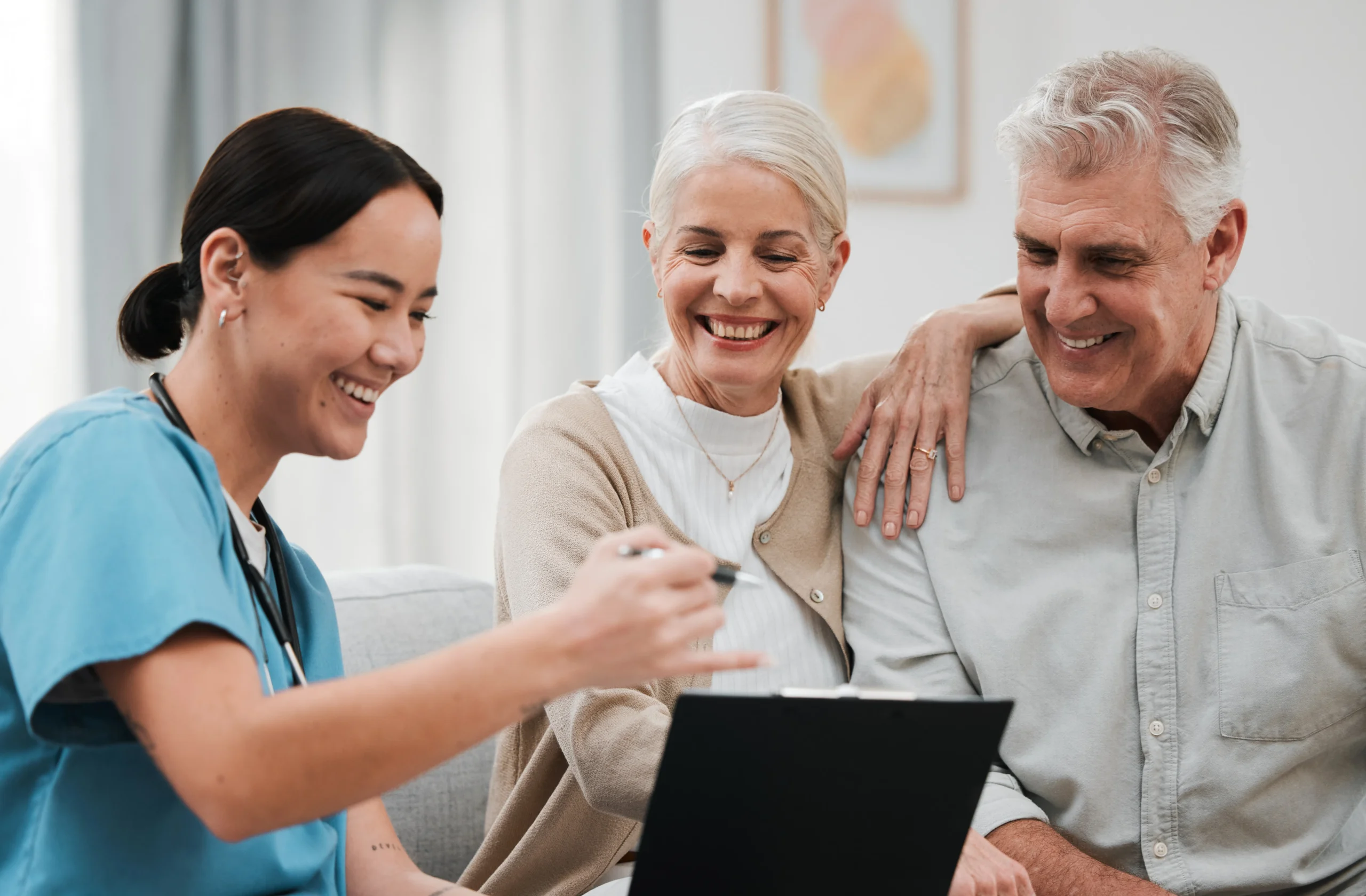 Nurse, healthcare and support with a senior couple in their home